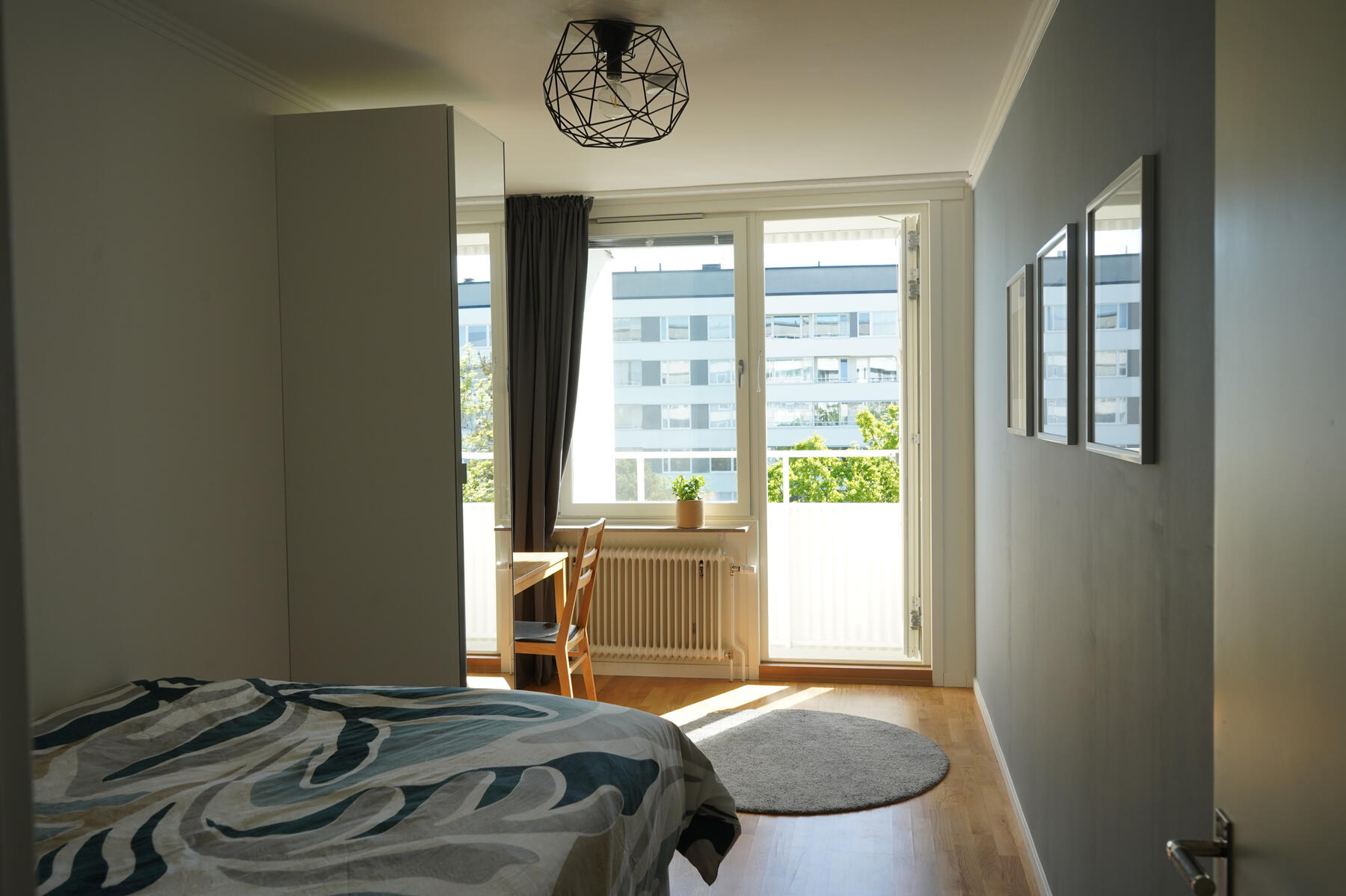 Guest room from the entrance (with balcony door open)